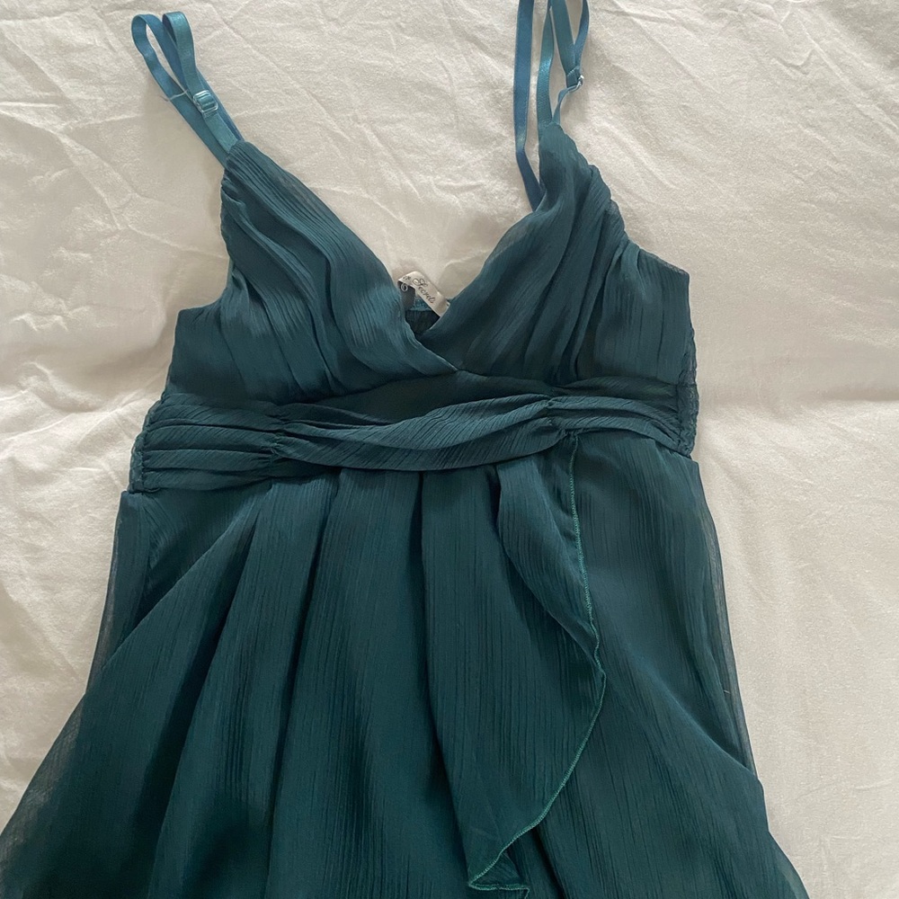 Dark green spaghetti strap cocktail dress.